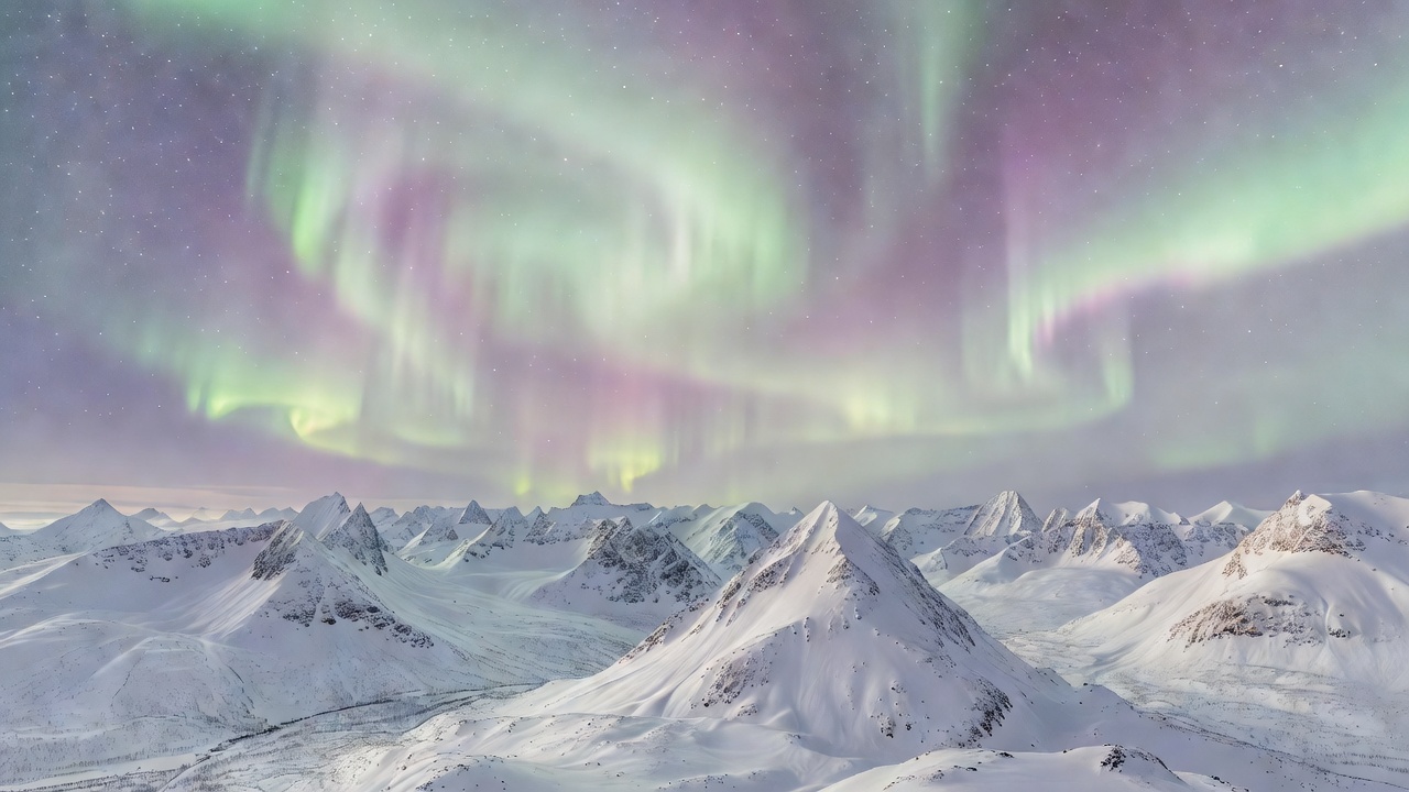 Soft aurora landscape over Nordic mountains
